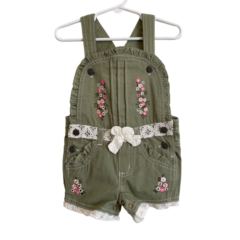 Green overall shorts embroidered lace ruffled pockets snaps buttons. Size 12mo